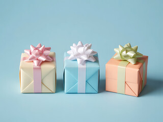 Pastel Gift Boxes with Bows Arranged on Light Blue Background