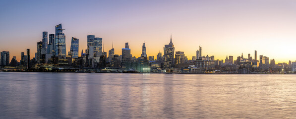 Panorama of the skyline of Midtown Manhattan in New York before sunrise seen from Hoboken, New Jersey