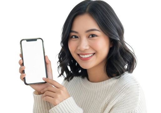 Smiling young asian woman holding a smartphone with a blank screen