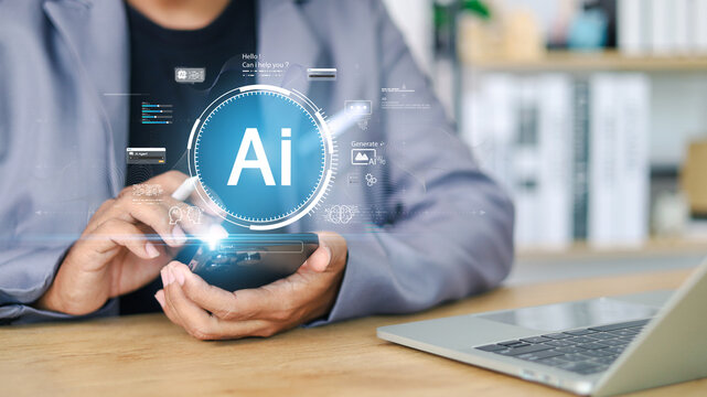 Artificial intelligence technology concept showing AI icon and digital interface with person using smartphone and laptop computer, symbolizing innovation, data analysis, and smart automation. - Powered by Adobe