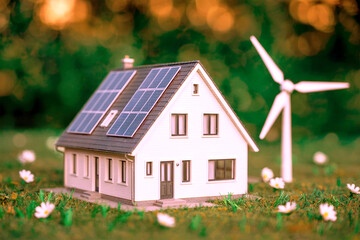 Eco Smart Home Model with Solar Panels and Wind Turbine in Green Field