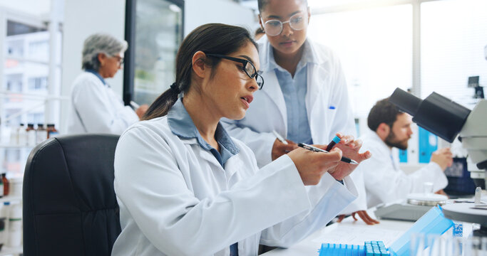 Woman, scientist and vial with blood sample for exam, text or experiment for medical research. Female person, scientific team or DNA with forensic investigation, diagnosis or genetic analysis in lab - Powered by Adobe