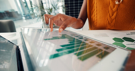 Document, data and hands with tablet screen in office, above and risk management for sustainability. ESG consultant, paperwork and person with tech for environmental benefits and renewable energy © FrameOn/peopleimages.com