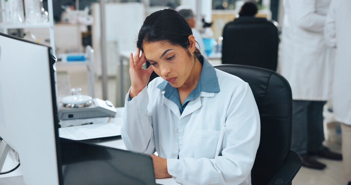 Scientist, woman and headache in lab with laptop for research, problem solving and workload fatigue. Thinking, exhausted person and migraine with computer, medical solution and science frustration.