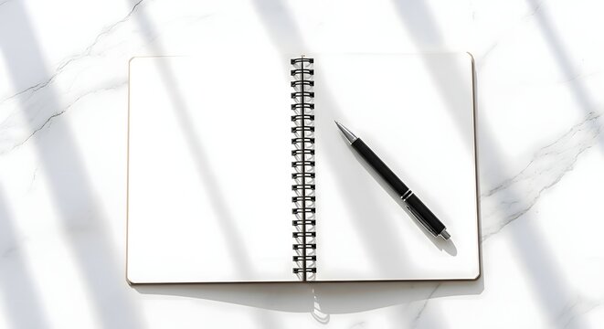 Blank Spiral Notebook with Pen on Marble Surface, Ready for Your Ideas