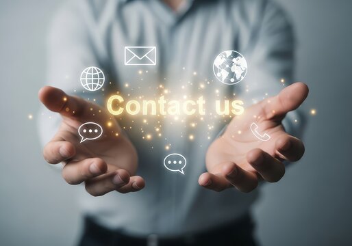 Man presenting contact us message with communication icons in his hands with a light background