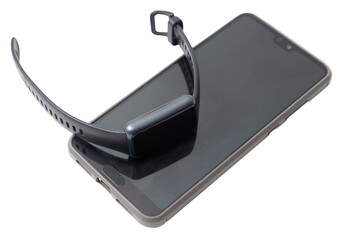 A smart watch is laying on top of a phone