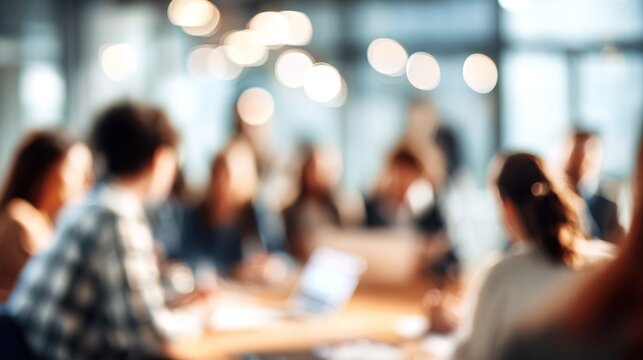 blurry image background image of a group of young people at a meeting in a conference room. High quality