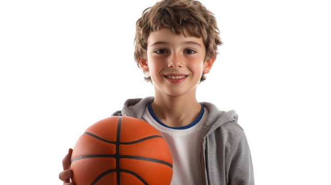Young boy holding a basketball isolated on transparent background in studio