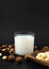 Macadamia nuts. Natural raw peeled macadamia seeds and shells