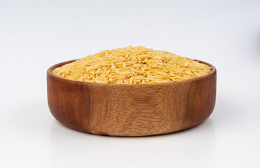 Raw orzo pasta, risoni or kritharaki pile