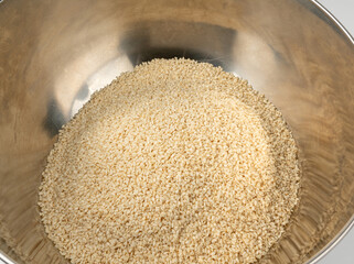 Sesame seeds pile closeup, white small benne grains. Sesamum indicum fruits