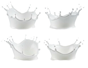 Four milk splashes in various crown-like shapes on dark background