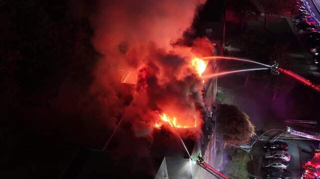 Aerial View of Firefighters Fighting a Multi-Alarm Fire at an Apartment Complex
