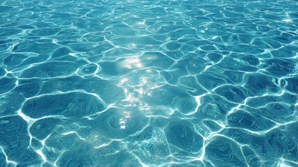 Obraz premium A shimmering blue water surface, reflecting sunlight, creating a calming and serene atmosphere.