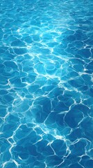 Obraz premium A vibrant image of shimmering blue water, showcasing the mesmerizing patterns and reflections on its surface.