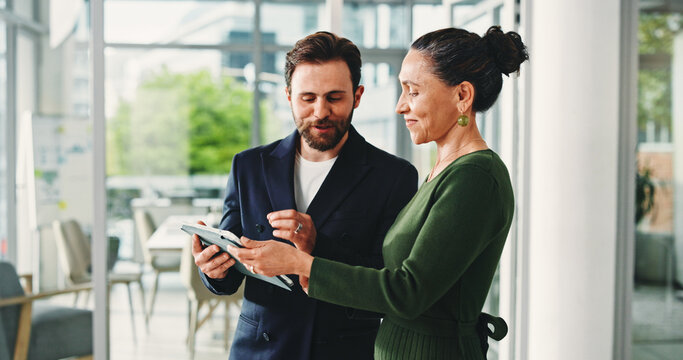 Business, people or tablet with advice in office for market shift, explain stock price or trading news. Trader, teamwork and discussion with tech for financial report, investment feedback and update - Powered by Adobe