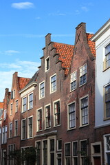Langebrug Street View with Old Brick House Facades in Leiden, Netherlands
