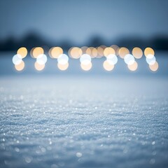 Abstract winter background with sparkling snow and golden bokeh lights.
