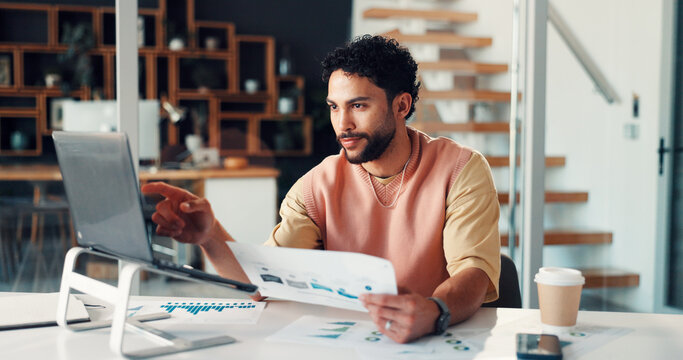 Man, reading and laptop with document at house for research, finance report and statistics. Accountant, remote work and pc with paperwork, revenue graphs and financial comparison of audit information