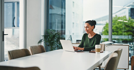 Business woman, laptop and typing with smile for accounting, email or finance in office. Female...