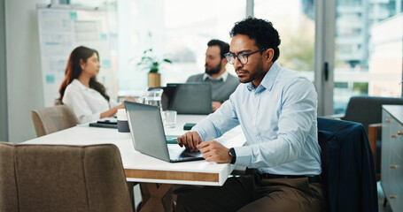 Serious, employee and man with laptop, office and research for wealth management, typing and...