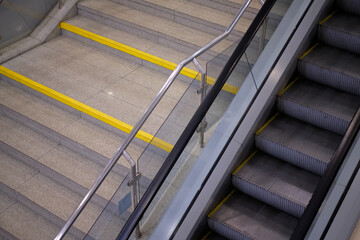 Stairs next to the escalator for lifting people