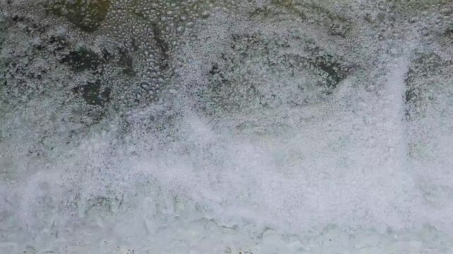 Clear water flows Creates bubbles of water