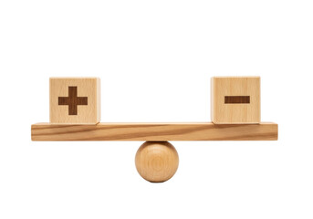 Two meticulously crafted wooden cubes with plus and minus signs perfectly balanced on a wooden beam and fulcrum against a transparent studio background, concept of strategic balance and thoughtful