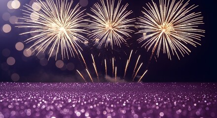 Spectacular golden fireworks explode in the night sky above a crowd of people watching a celebration