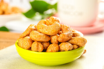Crispy Fried Vietnamese Cashew Nuts in Green Bowl - Traditional New Year Snack with Golden Amber Glaze