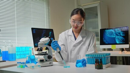 Asian female scientist working on dna research in laboratory - Powered by Adobe