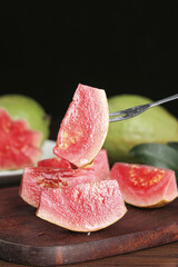 Fresh Red Guava Slices on Wooden Board - Tropical Fruit from Fujian