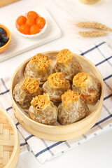 Handmade Siu Mai Dumplings with Fish Roe in Bamboo Steamer - Traditional Chinese Dim Sum Food