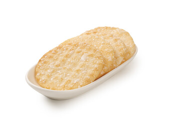 Japanese Senbei Rice Crackers on White Dish - Traditional Crispy Snacks