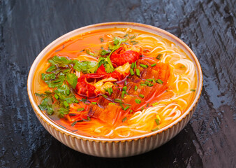 Handmade Shrimp Noodle Soup with Fresh Herbs in Ceramic Bowl - Traditional Asian Cuisine