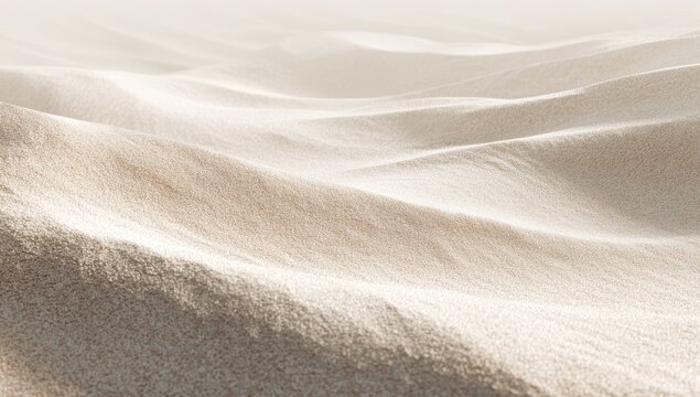 A close-up, soft-focus landscape with gentle, undulating sand dunes. Light and shadows play across the surface
