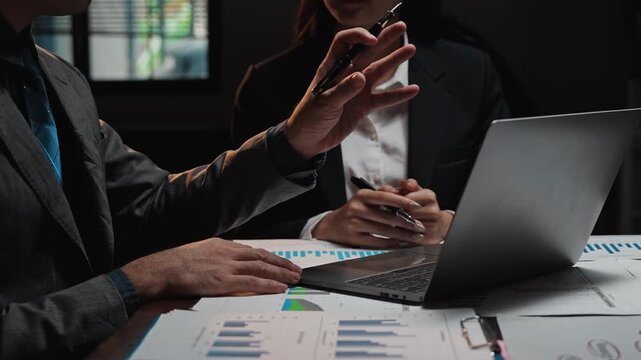 Business people discussing financial data in a meeting - Powered by Adobe