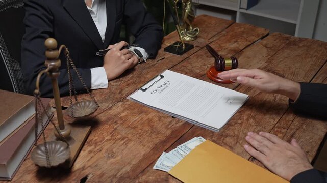 Client giving bribe money to a corrupt female lawyer