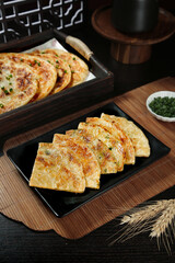 Crispy Fried Scallion Pancakes Traditional Asian Food on Wooden Bamboo Serving Tray