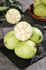 Fresh Guangxi Guavas with Cream Flesh on Slate - Tropical Fruit Food Photography