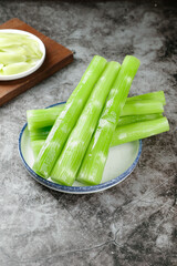 Fresh Green Celery Stalks on Rustic Plate - Healthy Vegetable Ingredients for Farmhouse Kitchen Cooking