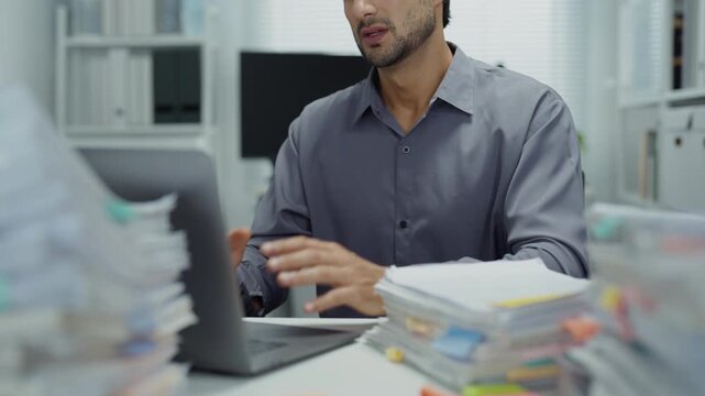 Tired employee using laptop in office at night, insomnia, anxiety and burnout, deadline pressure, financial
