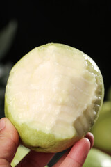 Fresh White Guava Fruit with Heart Bite Mark Held in Hand - Guangxi Tropical Fruit