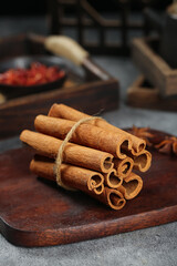 Natural Cinnamon Sticks Bundle from Guangxi - Aromatic Spice Seasoning on Rustic Wooden Board
