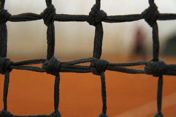 Close-up of Tennis Net on Clay Court &ndash; Focus, Precision and Determination Concept