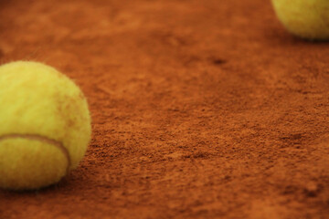 Tennis Balls on Clay Court Surface &ndash; Minimal Sport Texture and Focus Concept
