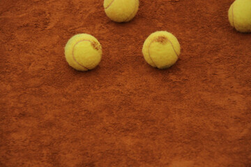 Tennis Balls on Clay Court Surface &ndash; Minimal Sport Texture and Focus Concept