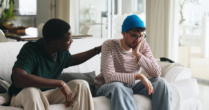 Support, grief and friends on sofa with console, comfort and understanding during bereavement. Mental health, empathy and people in house with conversation, condolences and shoulder rub in mourning.