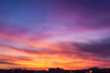 Fototapeta premium Blurred sunset view over city